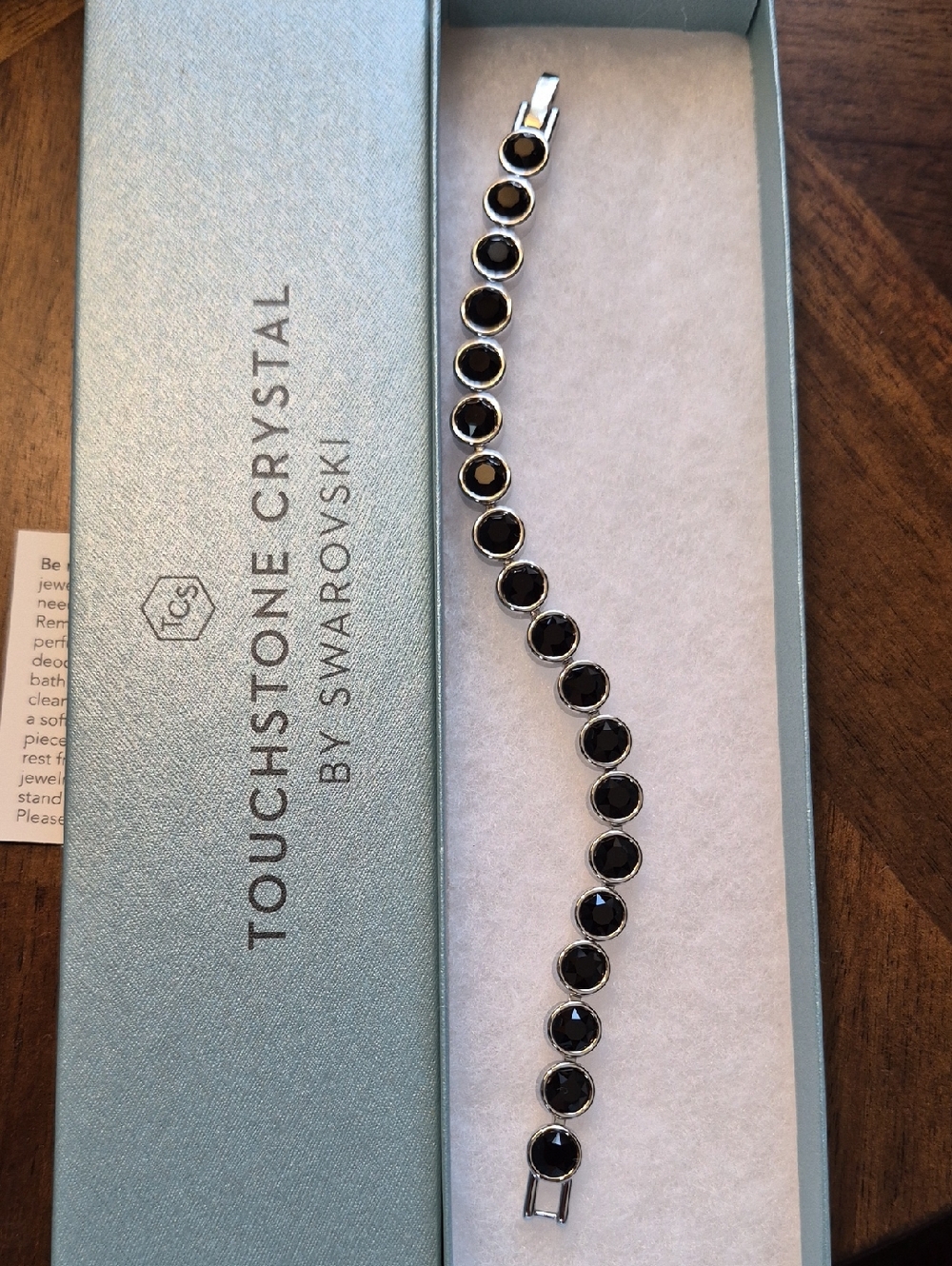 Touchstone Crystal Black Crystal Round Tennis Bracelet in Silver Tone
